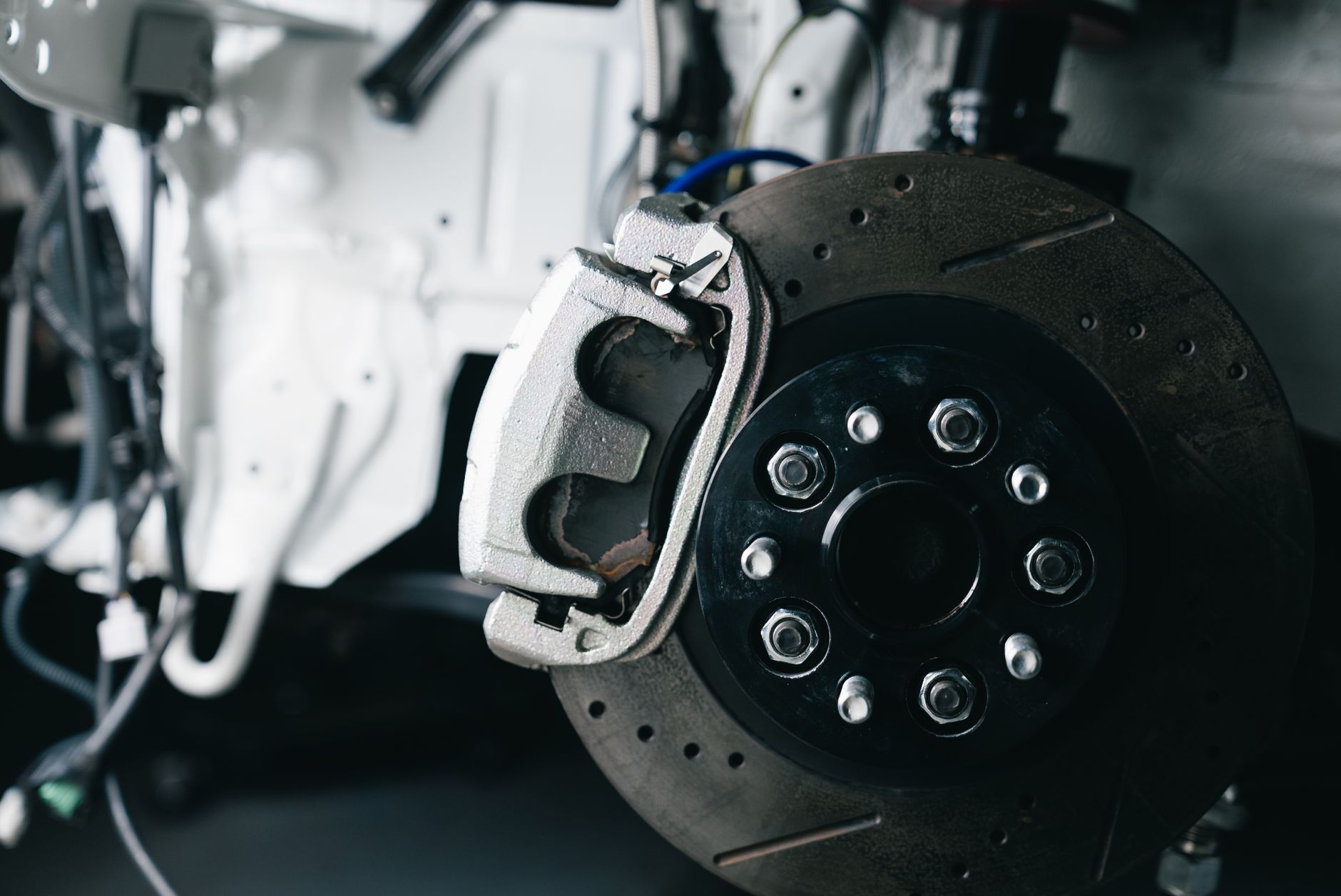 A worn brake disc and caliper